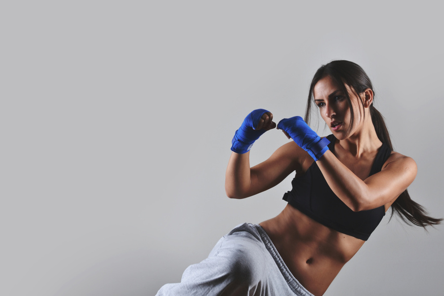 woman doing kickboxing in sportswear